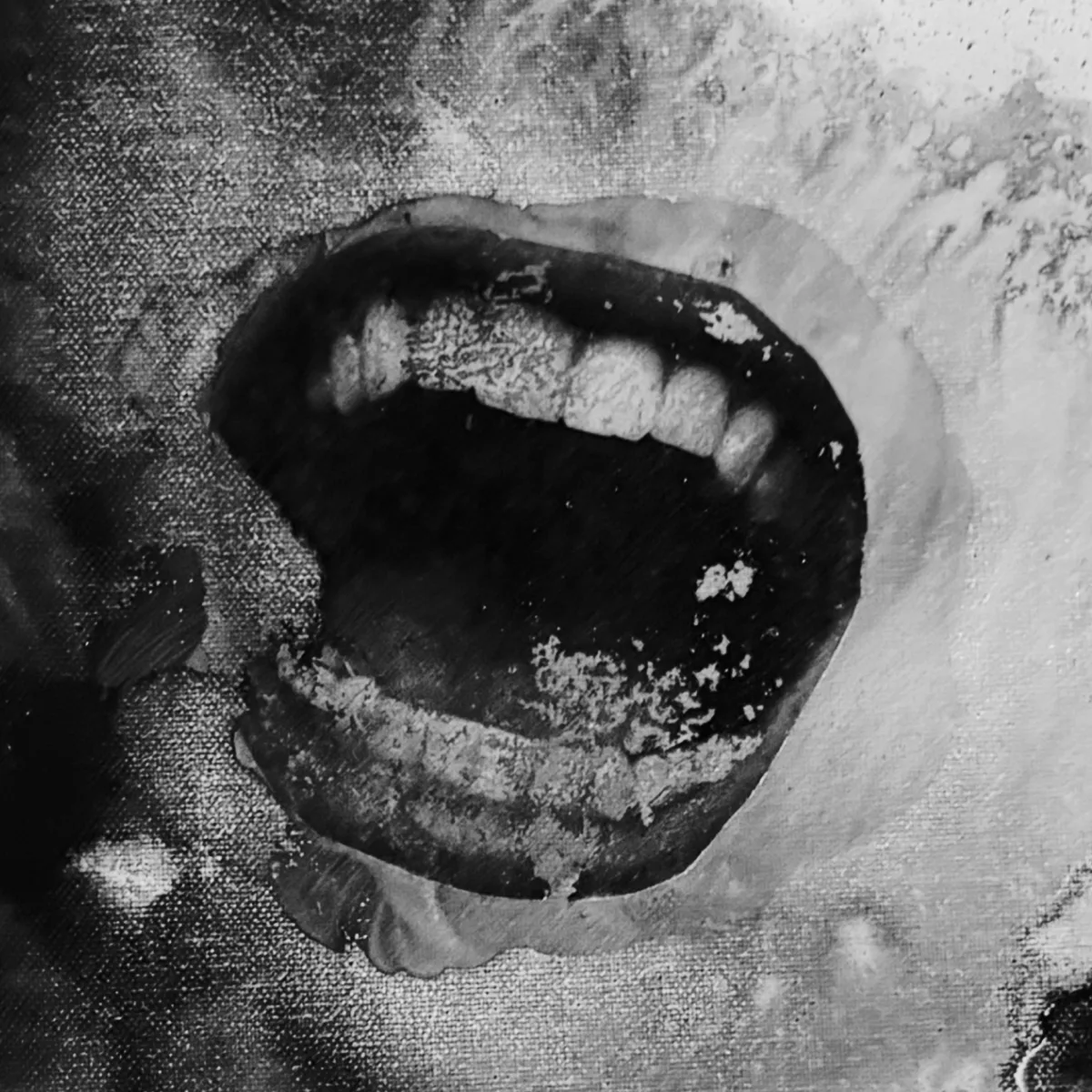 An open mouth, rendered in torn and degraded photographic texture
